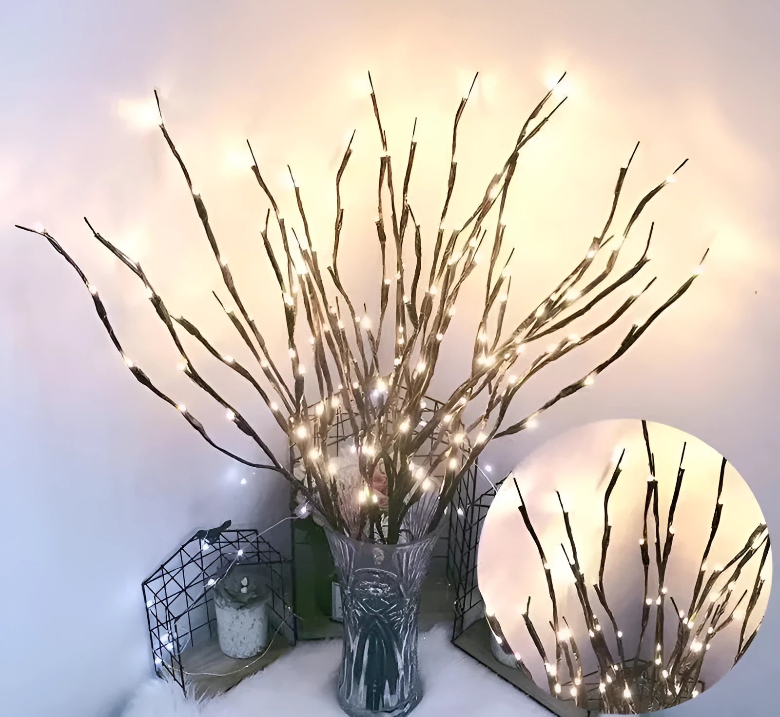 LED decorative tree light with silver branches in a vase, emitting coloured light.
