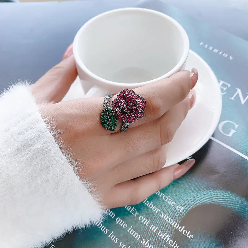 Geometric black gold personality ring with red corundum stones