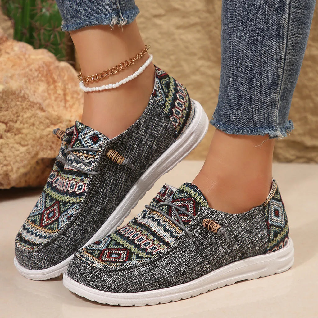 Women's flat round toe low-top shoe in artificial PU, available in black, dark grey, and khaki.