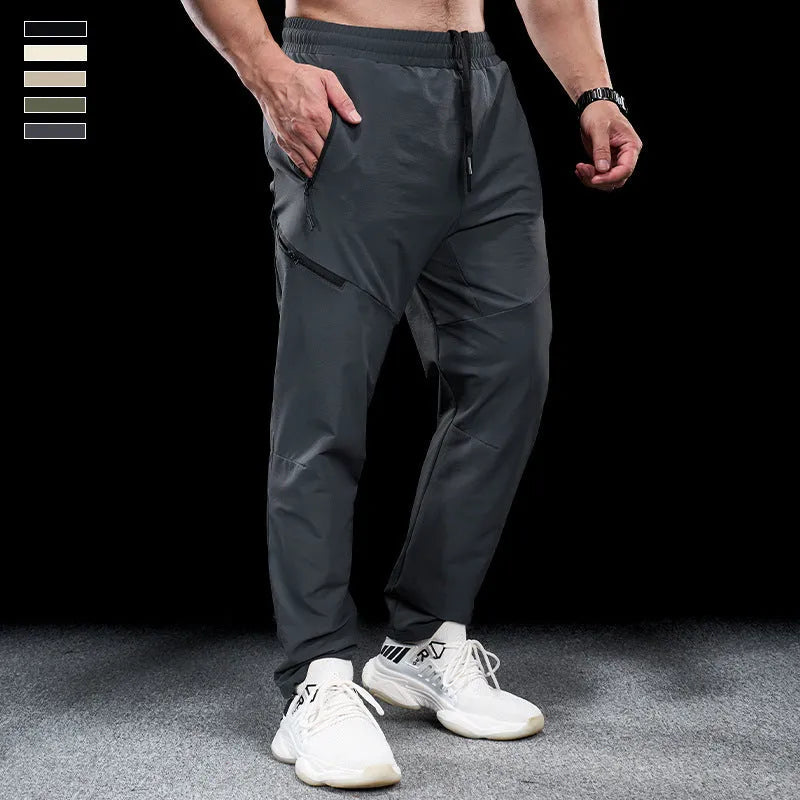 Men's waterproof quick-drying nylon workout pants in Army Green colour, showing mid waist design and trousers length
