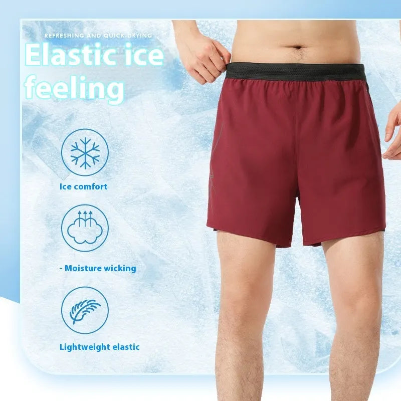 Men's black polyester basketball shorts with low-waist elasticated waistband laid flat