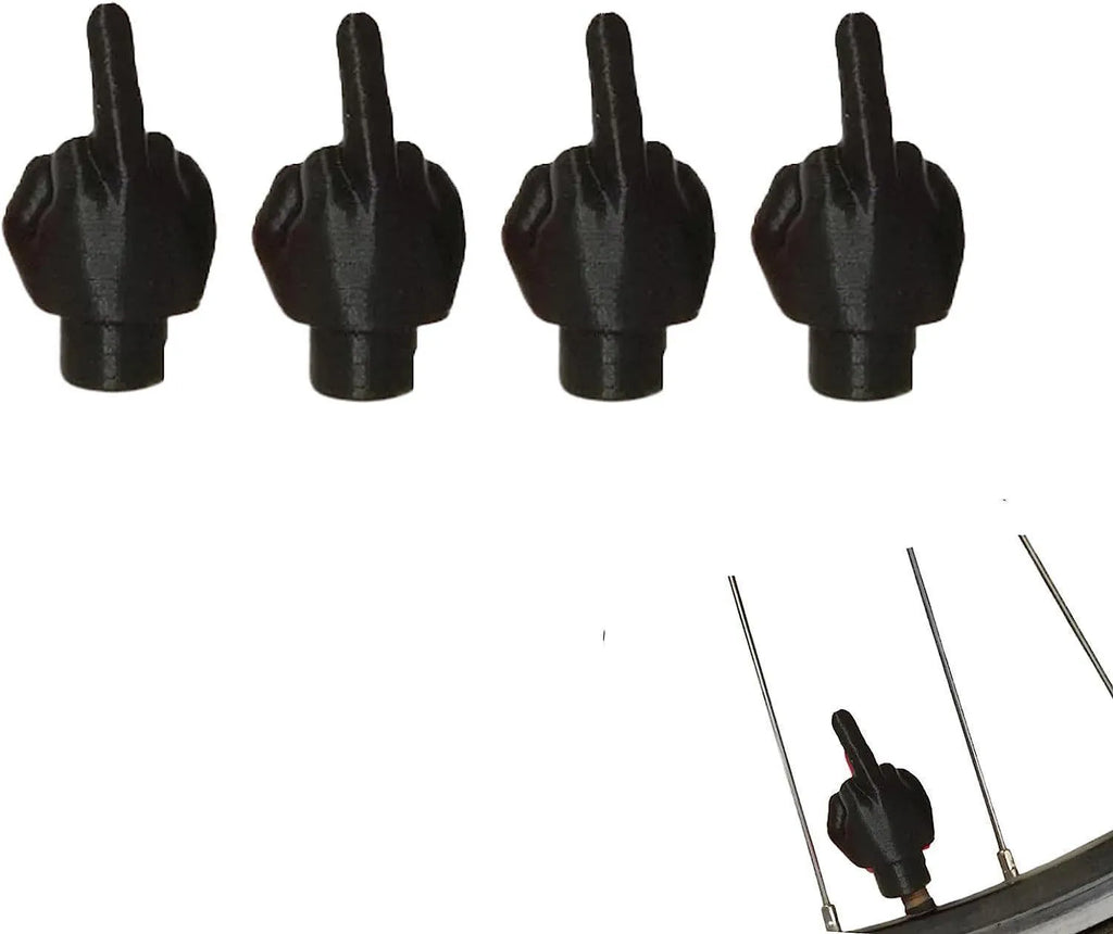 Four latex car tyre valve dust caps showing black and skin colour pieces for valve stem protection