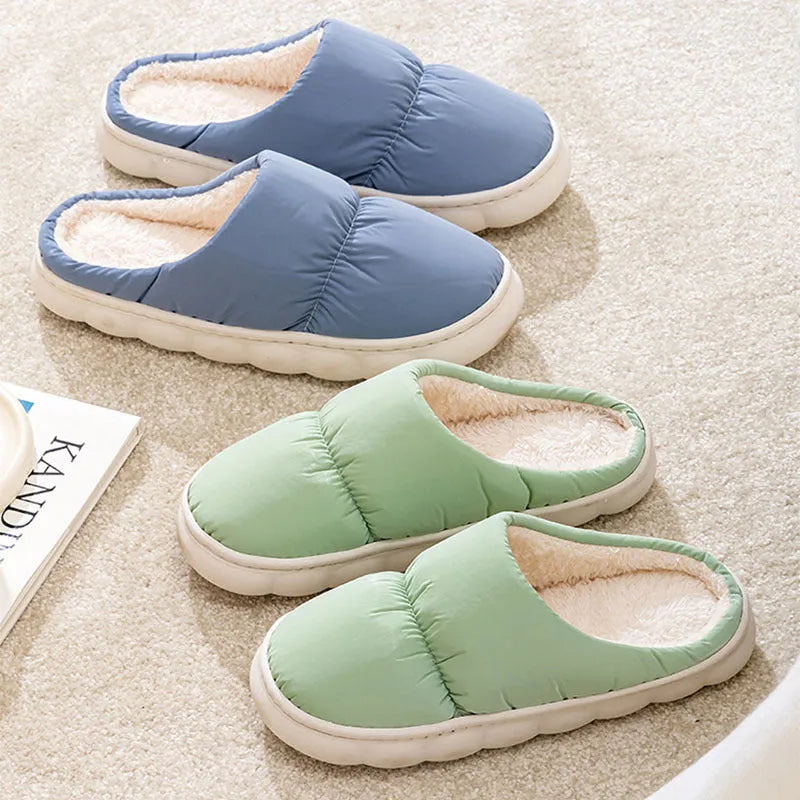 A pair of thick-soled plush slippers with artificial leather uppers and non-slip rubber soles in a choice of five colours.
