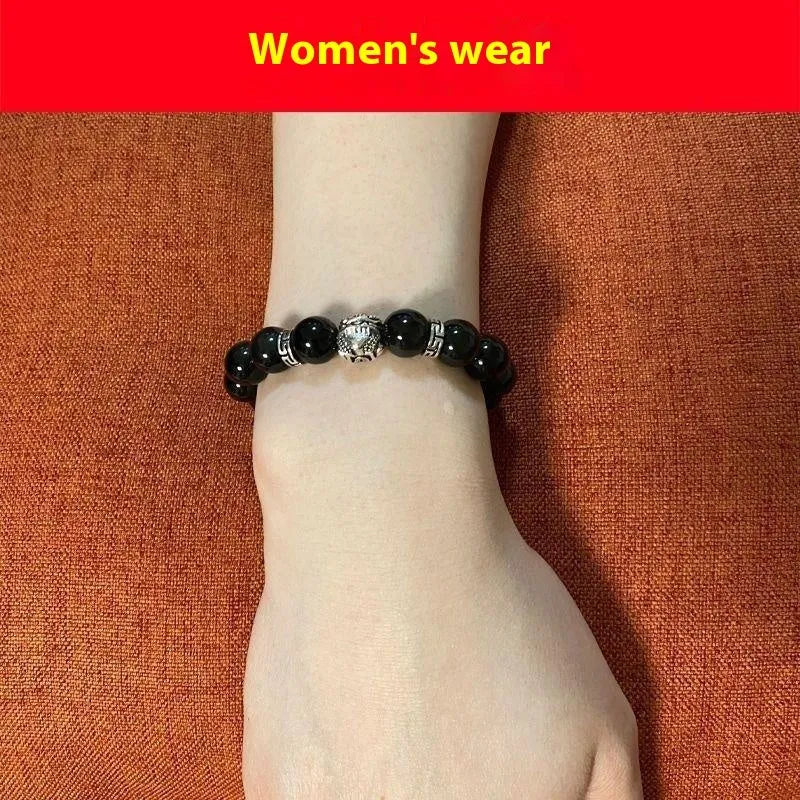 A silver and black obsidian bead bracelet showing lucky colour eye pattern, displayed in two sizes.
