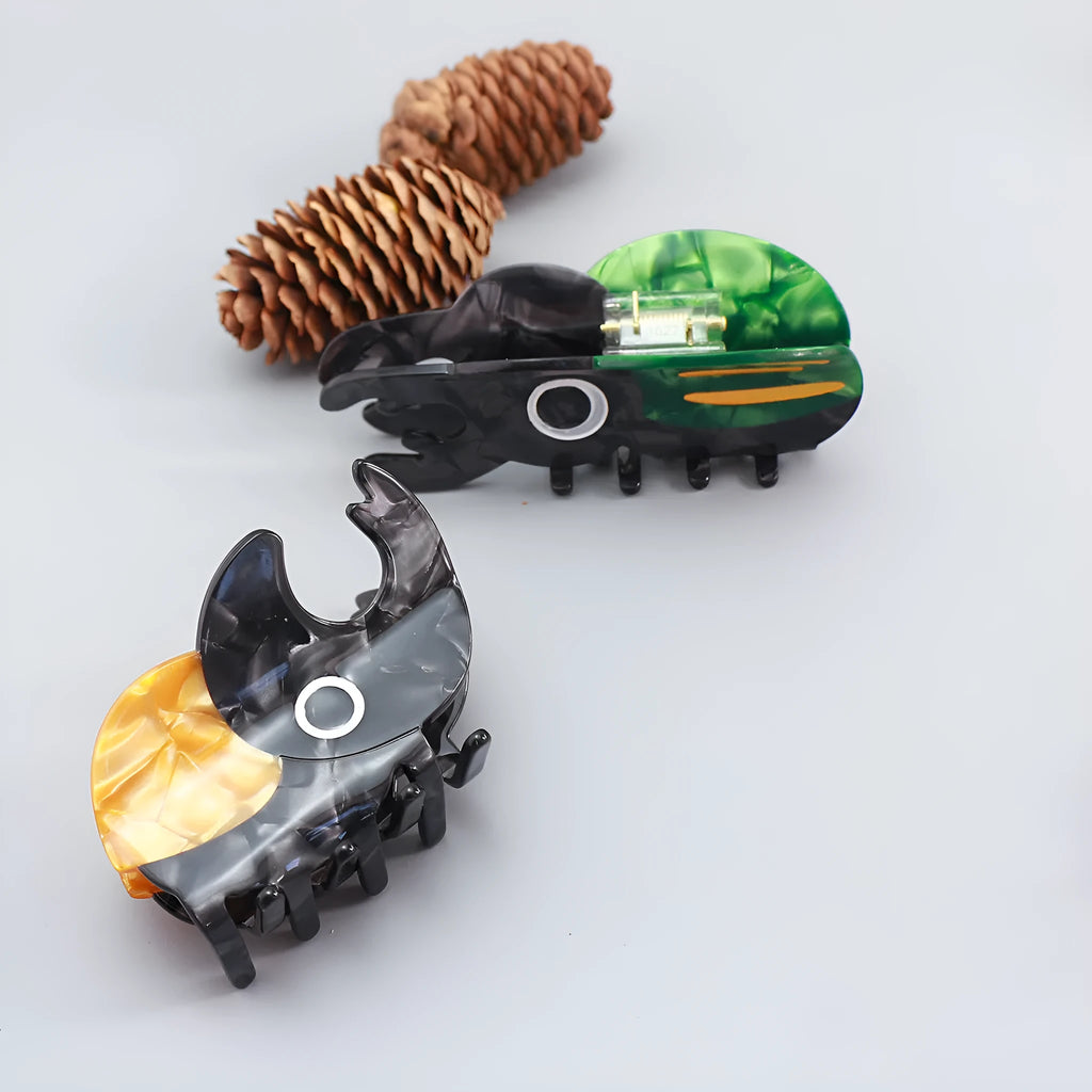 Handmade cellulose acetate Beetle Grip insect biology teaching tool with cartoon caterpillar design