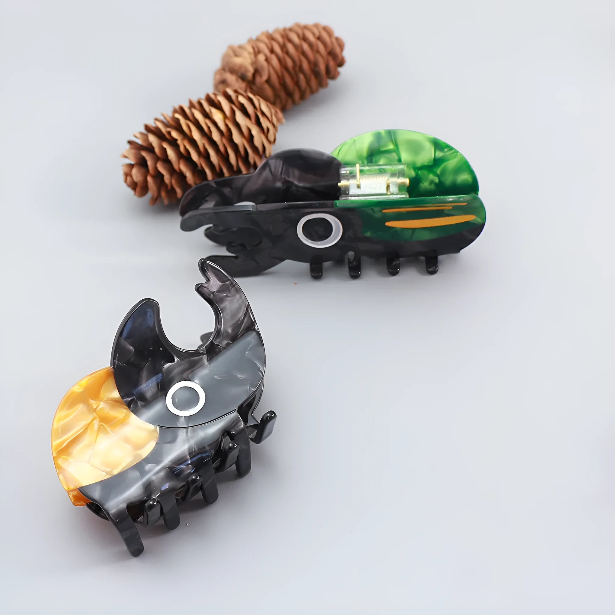 Handmade cellulose acetate Beetle Grip insect biology teaching tool with cartoon caterpillar design