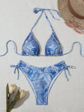 Denim blue women's bikini set with printed design and strap detail, sizes S to XL.