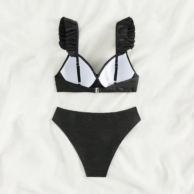 Women's solid colour bikini swimsuit in black laid flat, showing top and bottom pieces.