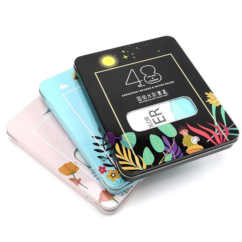 48 colour solid watercolour paint set in box showing Black Knight, Girl Pink and Sunshine Blue pans
