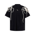Black loose fit short-sleeved T-shirt with rivet ribbon padded shoulder detail