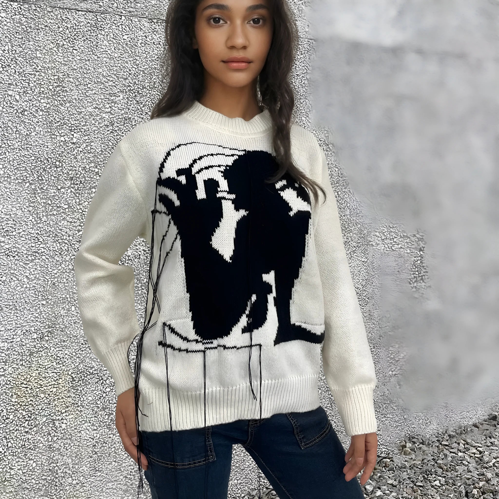 Women's loose alpaca wool sweater with abstract pattern and tassel detailing in street fashion style