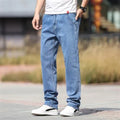 Men's straight leg jeans in smoky gray colour with low waist and zipper fly closure