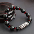 Hand-woven black agate Dzi bead bracelet with geometric design and national style elements