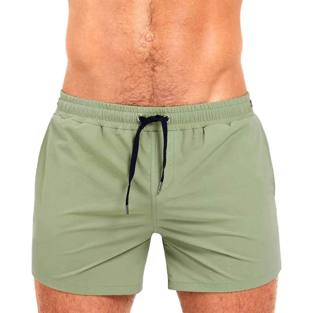 Solid colour swimming shorts with mesh lining for sports and fitness activities