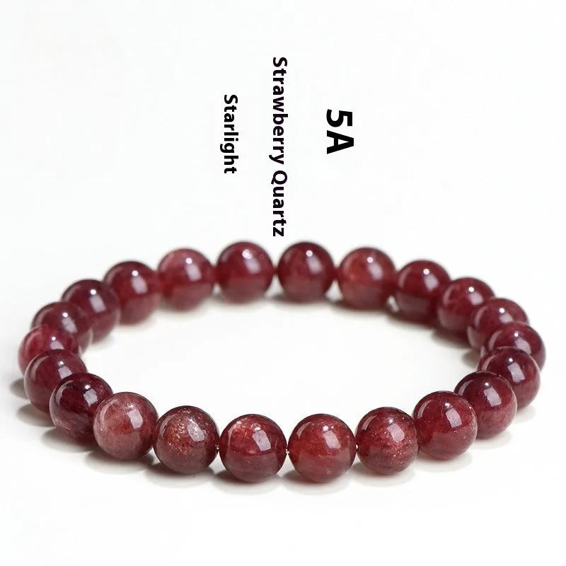 Natural cherry red strawberry quartz bracelet with polished geometric beads on a white background.