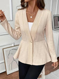 Women's apricot knitted cardigan with one button and jacquard pattern on a hanger.