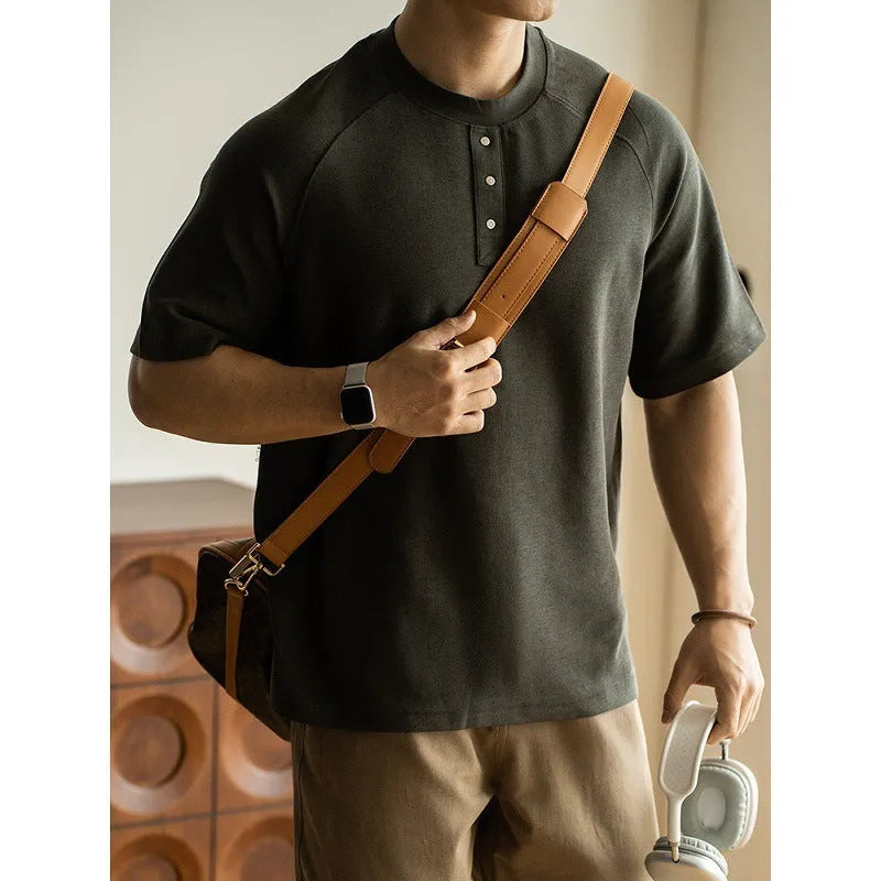 Casual loose-fitting pullover top with raglan sleeves in a terry texture fabric.