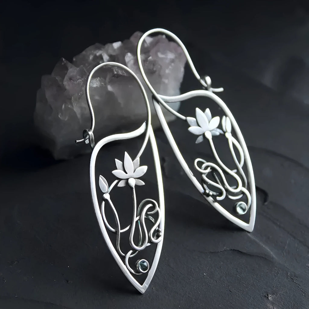 A pair of silver women's earrings with a lotus vine and geometric design featuring round rhinestones.