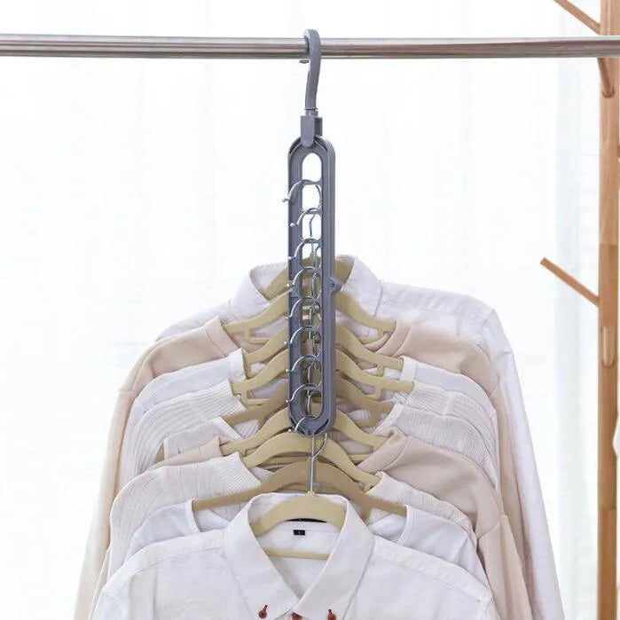 Pink or green heavy-duty plastic clothes hanger with rotating hook, shown holding a coat.