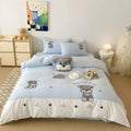 Schnauzer cartoon embroidered cotton bedding set with quilt cover, sheet, and pillowcases on bed