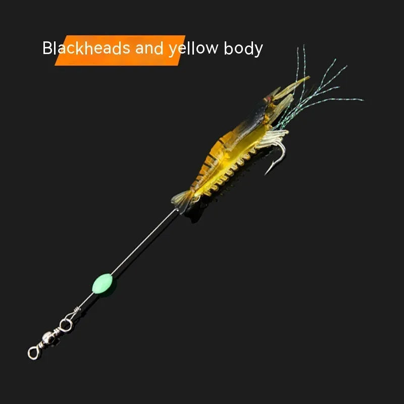 Soft plastic fishing lure with metal hook in black head yellow body colour variant