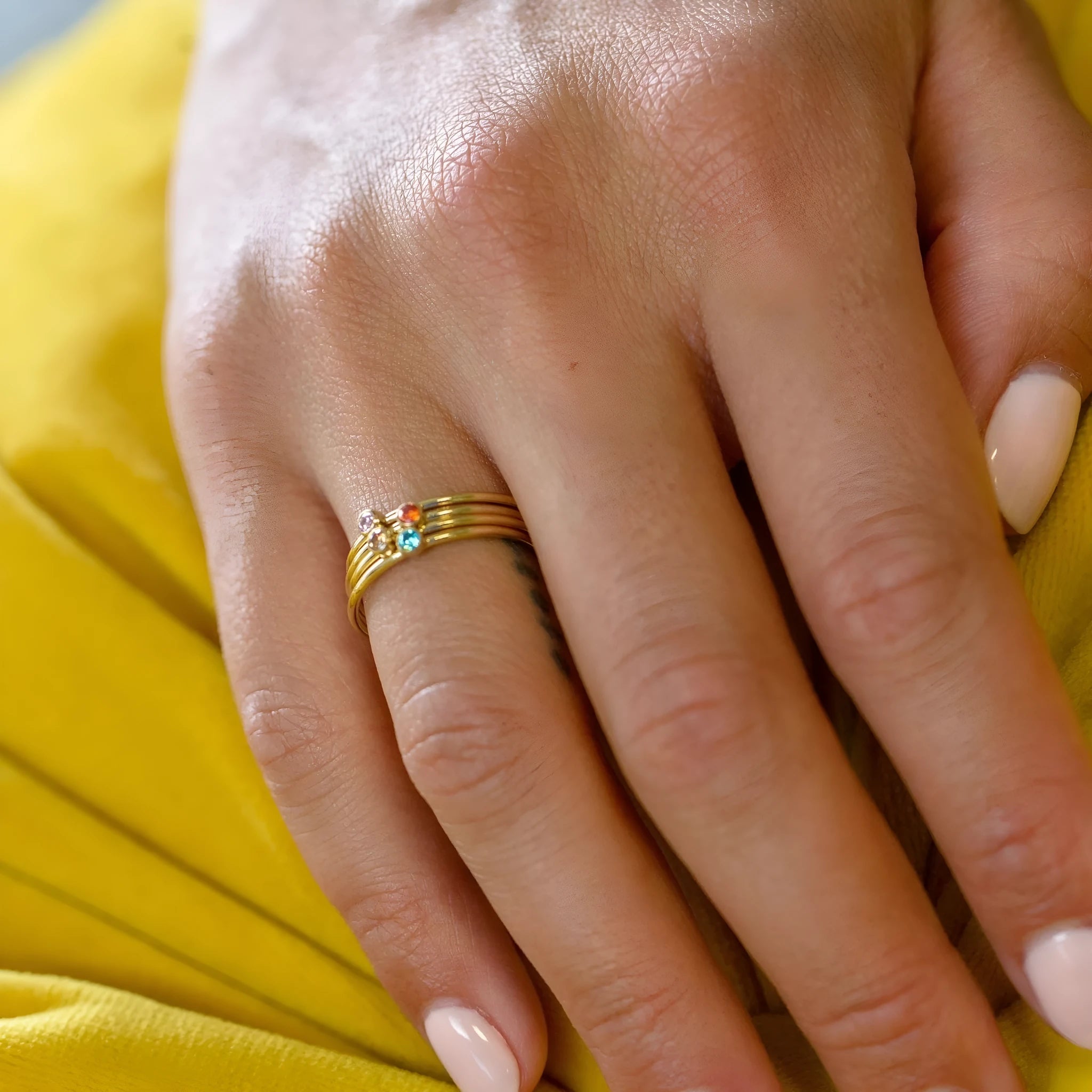 December birthstone engraved titanium steel ring with geometry shape on a grey background
