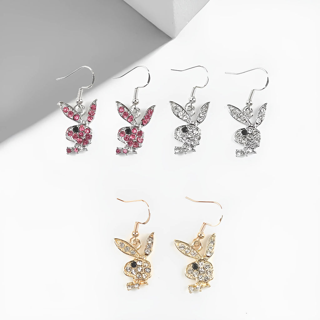Close-up of alloy rabbit stud earrings with full diamond detail in silver, pink, or gold colour.
