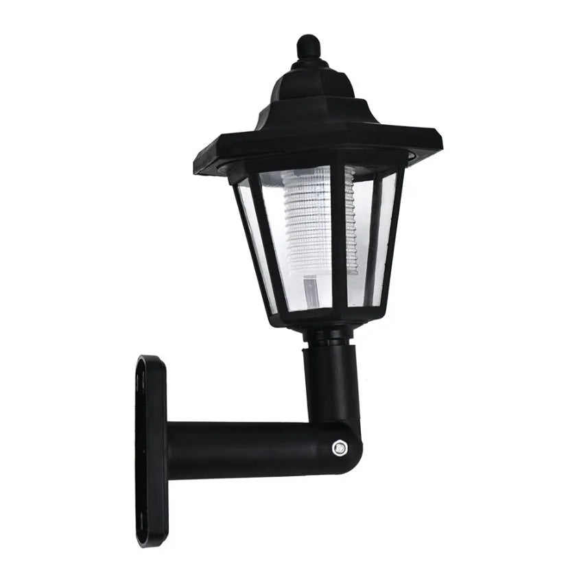 Black hexagonal solar-powered outdoor wall lamp with integrated solar panel