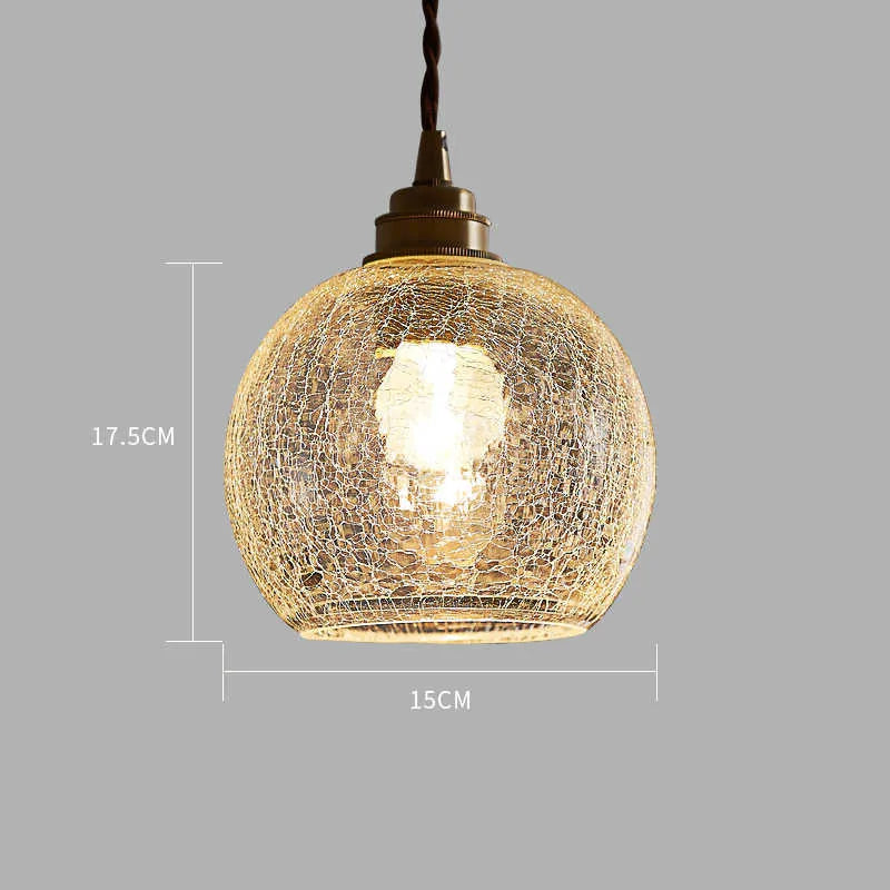 Retro brass chandelier with glass ball shade measuring 17.5 by 15 centimetres