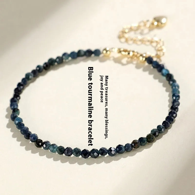 Blue tourmaline bracelet with 3mm cut beads and spacer bead design