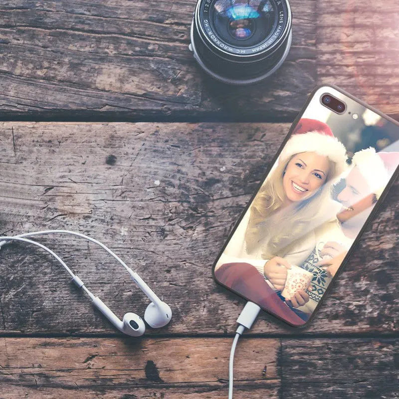 Slim patterned iPhone case with raised edges protecting a smartphone.