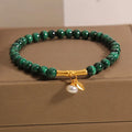 Women's white crystal bracelet with bamboo charm on adjustable metallic chain showing length between 20-24cm