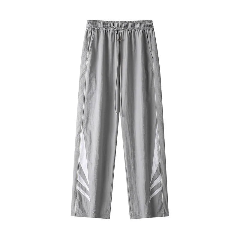 Men's straight-leg loose fit summer sports trousers in grey, showing button fly and elastic waistband.