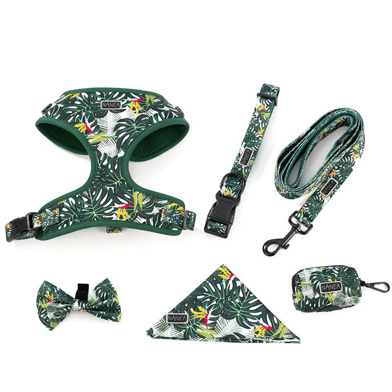Six-piece dog harness set showing cloth vest, leash, collar, waste bag, bow tie, and scarf laid out