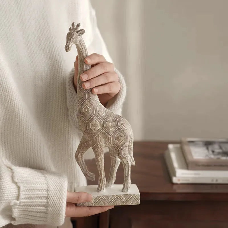 Wood-coloured synthetic resin giraffe ornament for home decoration.