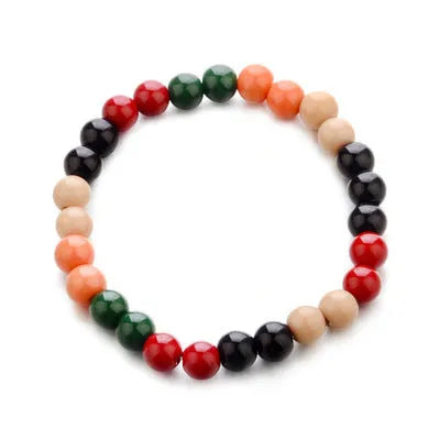 A natural lava stone bead bracelet with ethnic style on a wrist, demonstrating its unisex aromatherapy design.