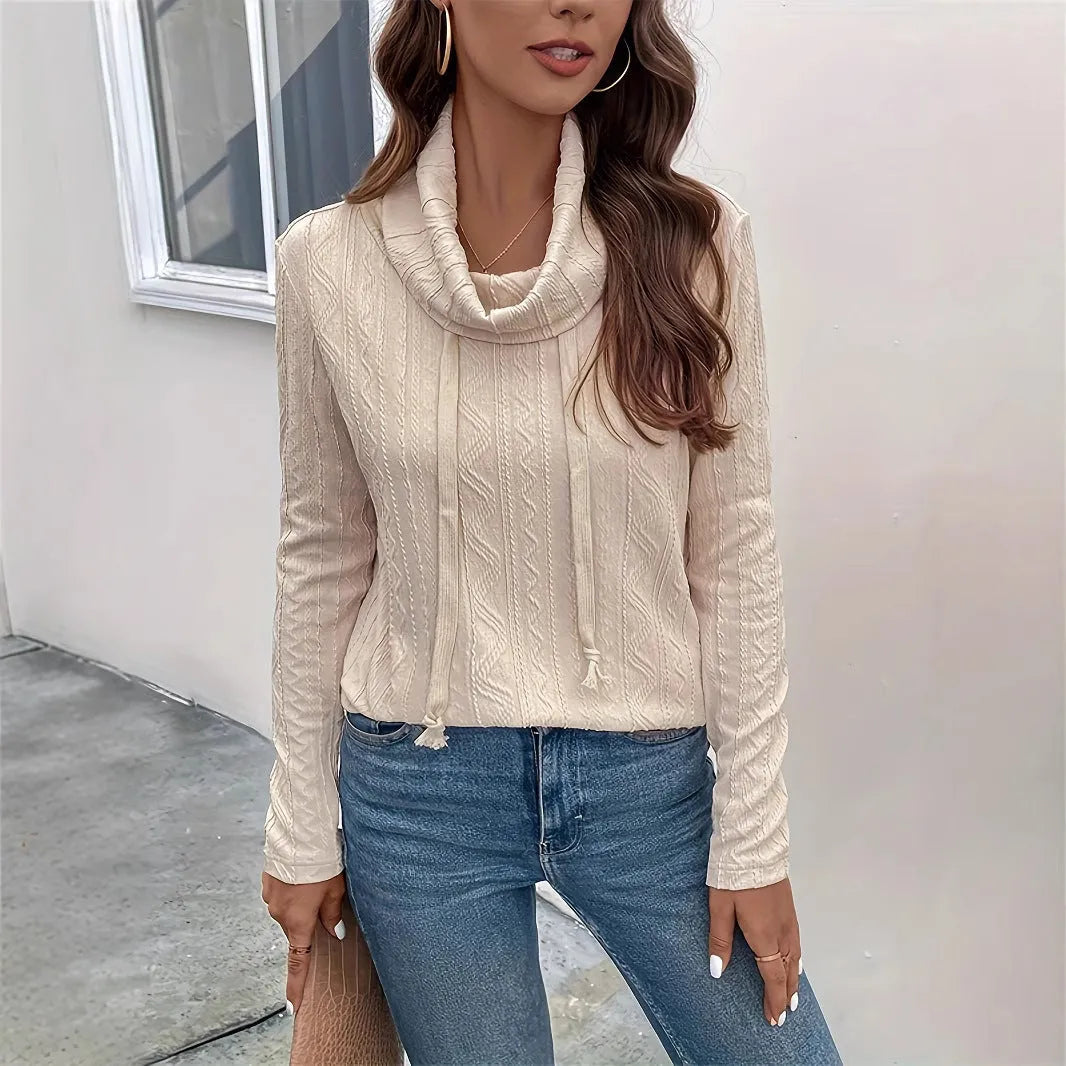 Apricot coloured long sleeve hooded pullover sweater with a drawstring.