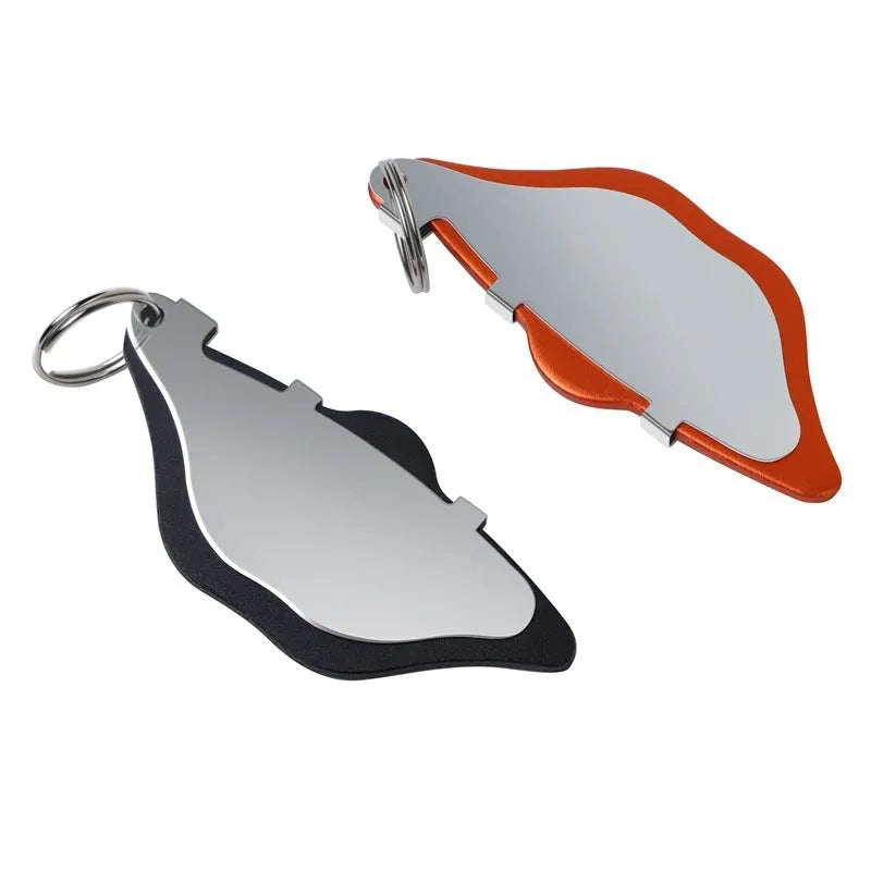 Black and orange mountain bike disc brake pads with metal construction and adjustment flaps