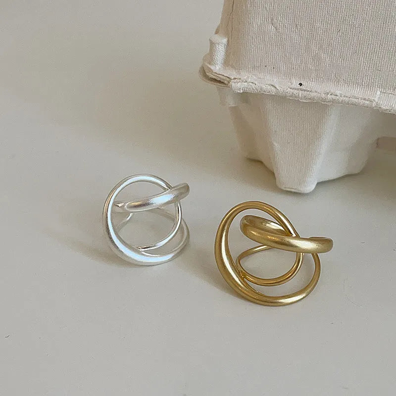 Three-dimensional interlaced geometric open ring with matte metal finish