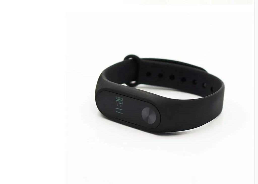 Xiaomi Mi Band 2 black fitness tracker on wrist showing OLED touchscreen display
