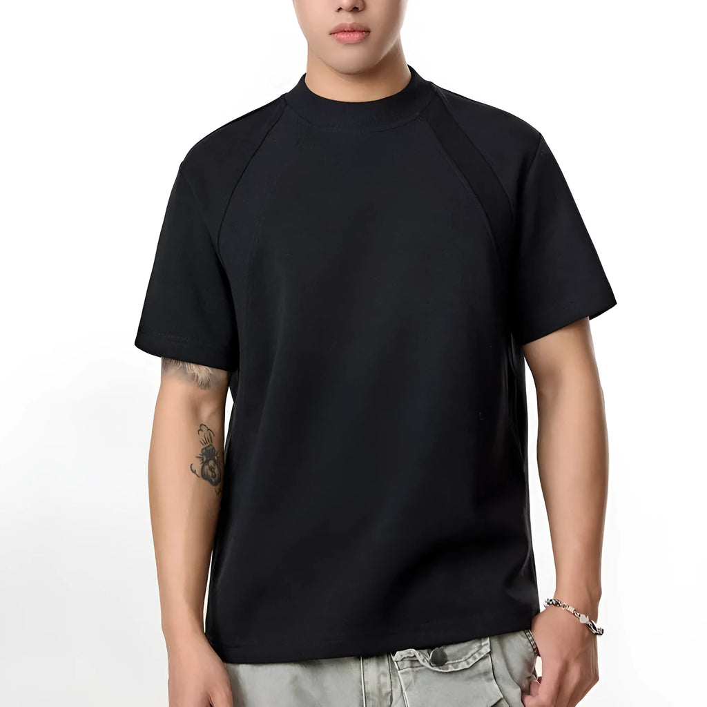 Black loose fit short sleeve top with textured air layer stitching design.