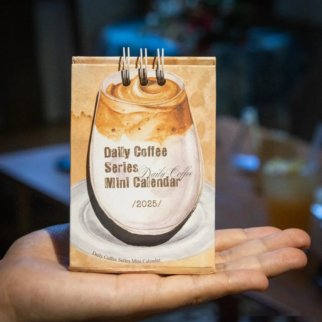 Mini 2025 desk calendar showing multiple design options including Coffee Time and Life Is Not Easy themes