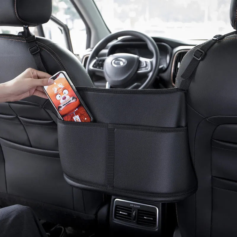 Black leather car seat storage bag with sports carbon fibre pattern measuring 38x24x15cm