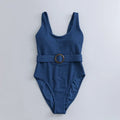 Navy blue women's one-piece triangle swimsuit with chest pads on a mannequin.