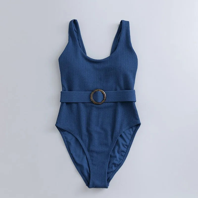 Navy blue women's one-piece triangle swimsuit with chest pads on a mannequin.