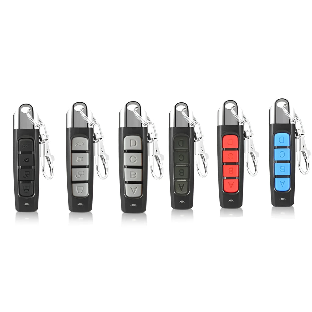 Rolling door remote control unit in choice of black, blue, grey, or red colours showing compact 6.7cm design