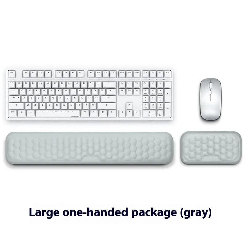 Memory foam mouse wrist pad with silicone bottom in black cloth cover on computer desk