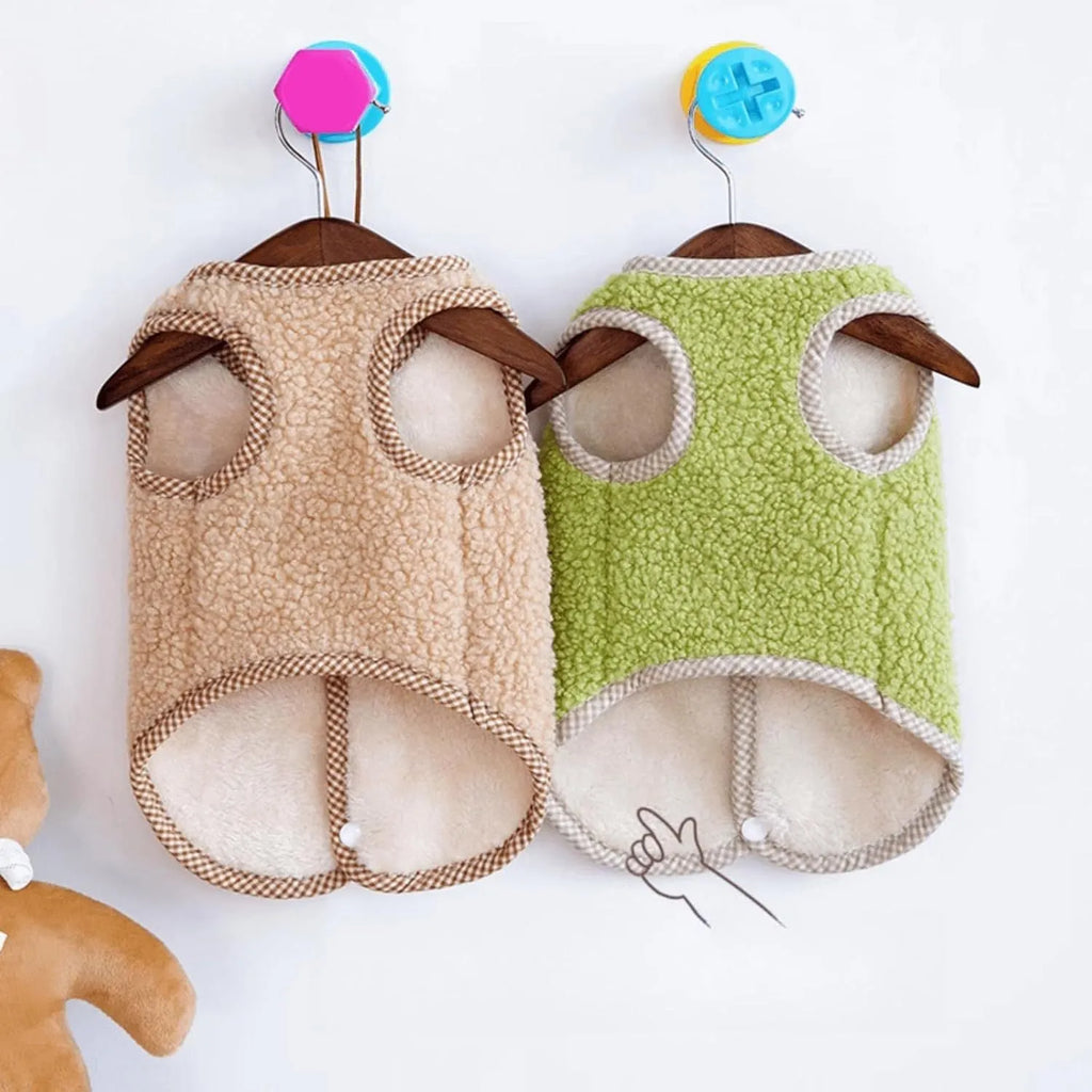 Green thickened coral fleece dog vest with a metal leash ring on the back, laid flat.