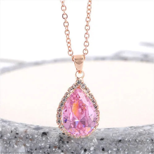 Women's water drop necklace with rose gold rhinestone and pink alloy gemstone pendant.
