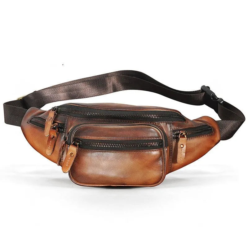 Brown cowhide leather messenger bag with a single shoulder strap, shown closed.